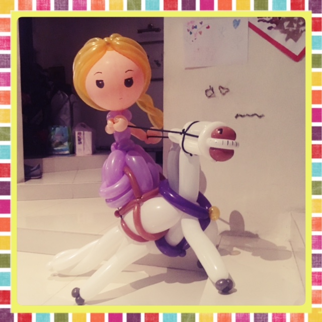 rapunzel on horse balloon sculpture