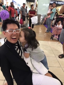 Mr bottle getting a kiss from an audience member after his show at the mall