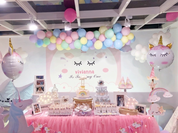 unicorn banner and dessert table